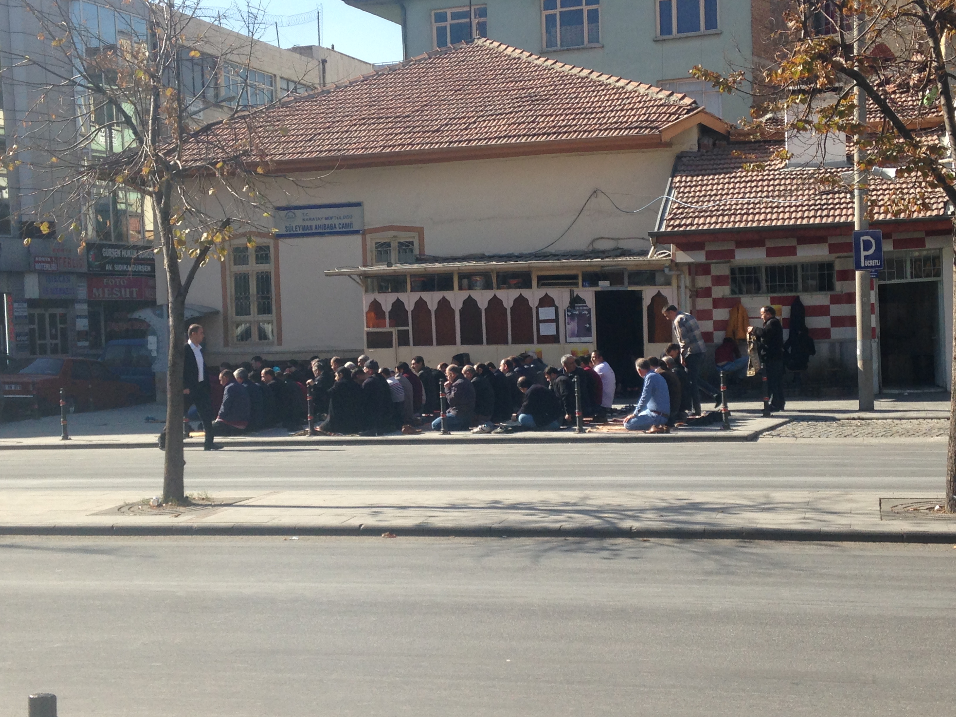 praying outside mosque in konya turkey